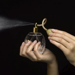 Woman Spraying Perfume With Perfume Atomizer, Close Up Of Hands